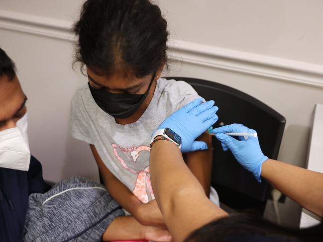 ANNANDALE, VIRGINIA - NOVEMBER 04: A child receives the Pfizer BioNTech COVID-19 vaccination at the Fairfax County Government Center on November 04, 2021 in Annandale, Virginia. The federal government approved the coronavirus vaccine for children between the ages of 5 and 11 this week.   Chip Somodevilla/Getty Images/AFP == FOR NEWSPAPERS, INTERNET, TELCOS & TELEVISION USE ONLY ==