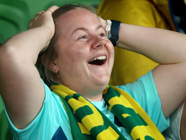 A Matildas fan watching at Melbourne’s live site can barely believe it. Picture: Mark Stewart