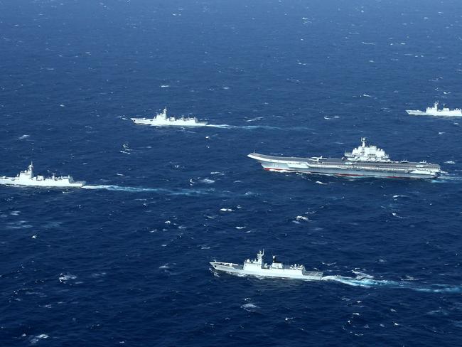 A Chinese navy formation, including the aircraft carrier Liaoning, in the South China Sea. Picture: STR/AFP