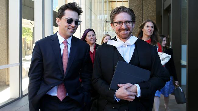 Journalist Joe Aston leaving the Federal Court with his lawyer Sandy Dawson QC in December. Picture: Jane Dempster