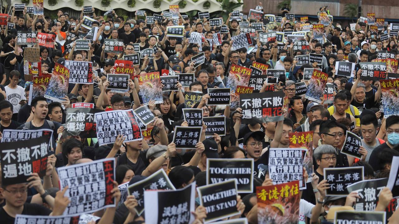 Thousands Of Protesters March On China Station The Australian