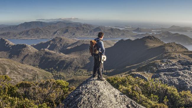 Peter Marmion on the summit of Mount Berry. The image features in Peter's new book Hidden Worlds. For TasWeekend. Picture: Jimmy Emms/Hobart Yachts