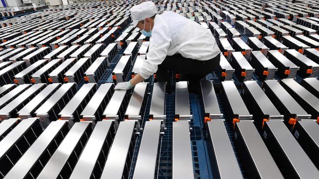 A worker at a factory for Xinwangda Electric Vehicle Battery Co. Ltd, which makes lithium batteries for electric cars and other uses, in Nanjing, China. Picture: AFP