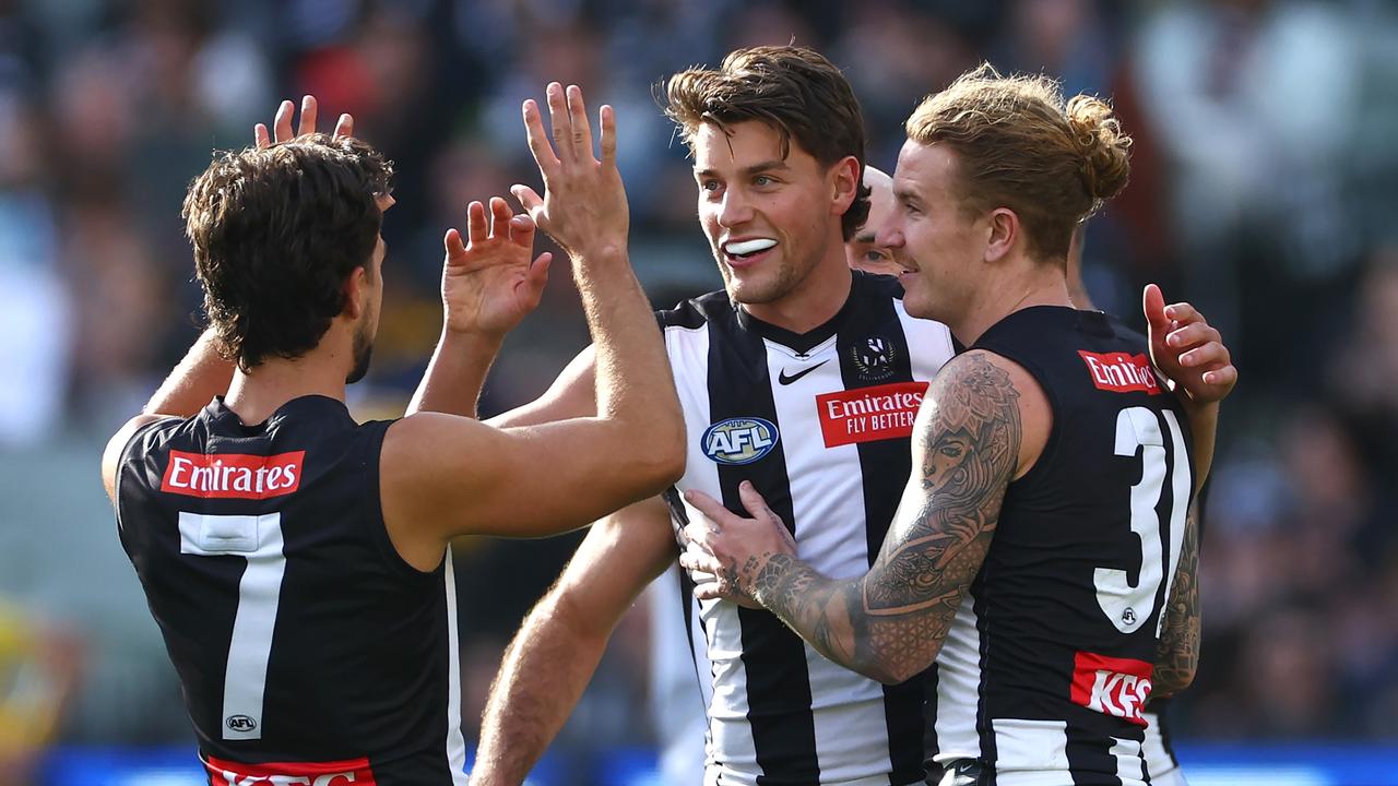 MELBOURNE, AUSTRALIA – APRIL 20: Patrick Lipinski of the Magpies is congratulated by teammates after kicking a goal during the round six AFL match between Collingwood Magpies and Port Adelaide Power at Melbourne Cricket Ground, on April 20, 2024, in Melbourne, Australia. (Photo by Quinn Rooney/Getty Images)