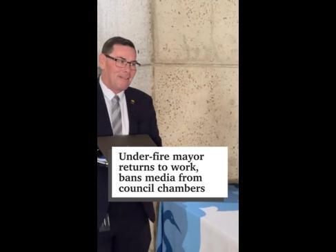 Under-fire mayor returns, bans media from council chambers