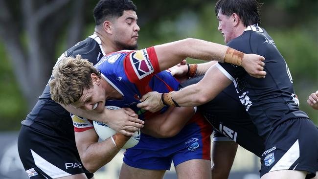 Cody Hopwood is tackled. Picture: Michael Gorton. NSWRL Junior Reps, SG Ball Cup round three, Newcastle Knights vs Western Suburbs Magpies at St Johns Oval, 17 February 2024