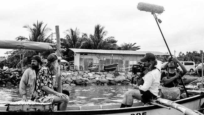 Kurzel, far left, and Ellis during filming for Ellis Park with director of photography Germain McMicking, right, with camera. Picture: Matthew Thorne