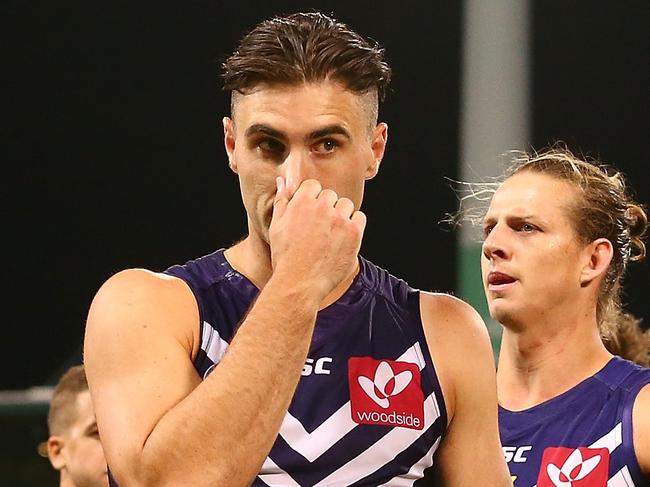 PERTH, AUSTRALIA - MARCH 26: Shane Kersten and Bradley Hill of the Dockers walk from the field after being defeated during the round one AFL match between the Fremantle Dockers and the Geelong Cats at Domain Stadium on March 26, 2017 in Perth, Australia.  (Photo by Paul Kane/Getty Images)