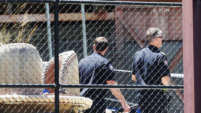 Police at Dreamworld the day after four people died on the Thunder River Rapids ride. Photo Steve Pohlner