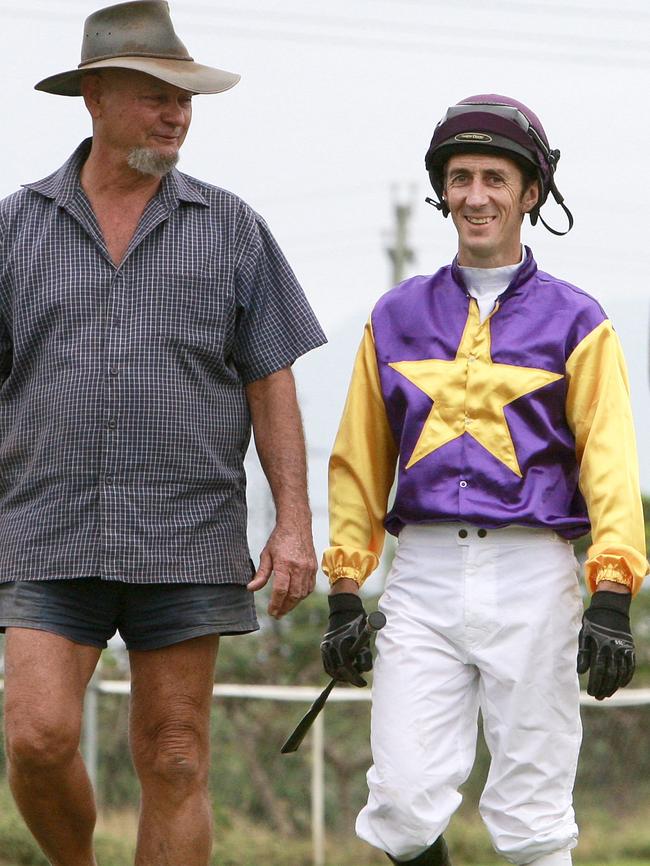 Trainer John Rowan and Jockey Kirk Stone inspect the track at Cannon Park.