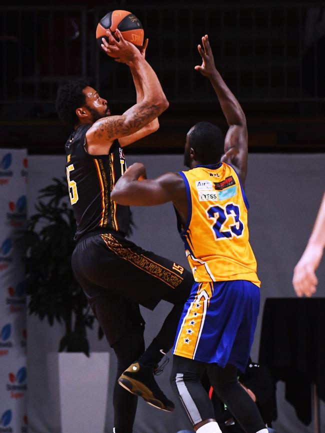 Southern Tigers’ Greg Mays shoots over Forestville’s Akol Deng. Picture: AAP/Mark Brake.