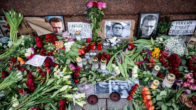 Flowers, candles and portraits of late Russian opposition leader Alexei Navalny at a makeshift memorial. Picture: AFP.