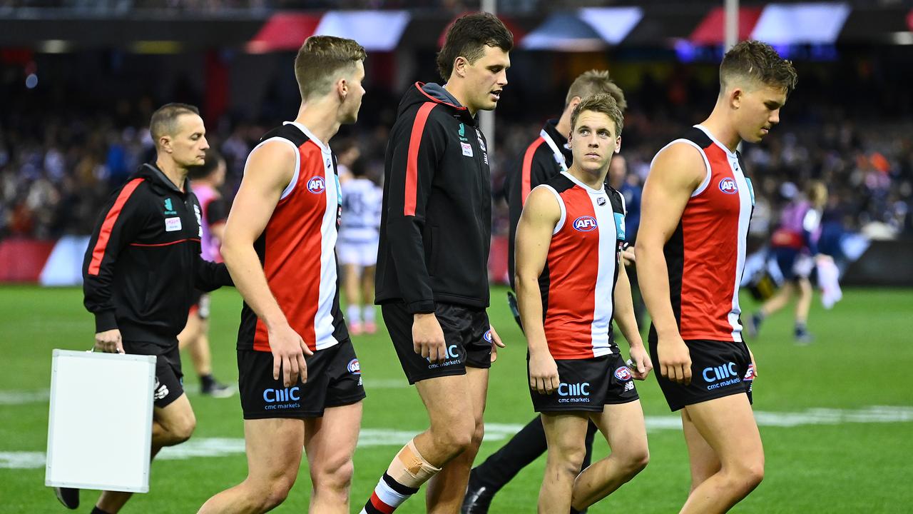 A dejected Rowan Marshall leaves the field with teammates during Friday’s clash with Geelong. Picture: Quinn Rooney/Getty Images