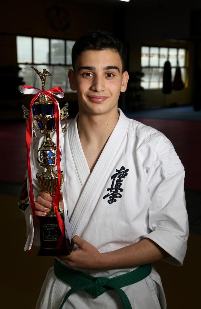 Saleh Amine with the trophy from his big karate tournament win in Japan. Picture: Hamish Blair