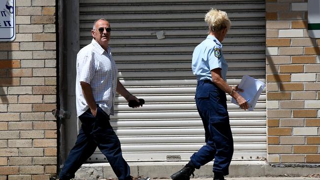 Orkopoulos with police after being arrested for an alleged parole breach. Picture: Bianca De Marchi