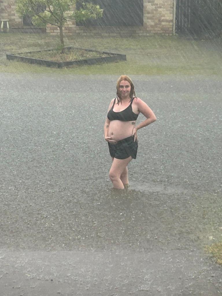 Jasmyne Pinkster of Eli Waters braves the rain amid the wild weather brought by ex-Tropical Cyclone Alfred.