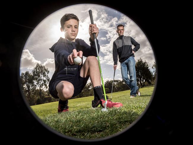 Oscar Brazzale, 14, and his father Danny are regulars at Strathallan Golf Club. Picture: Jake Nowakowski