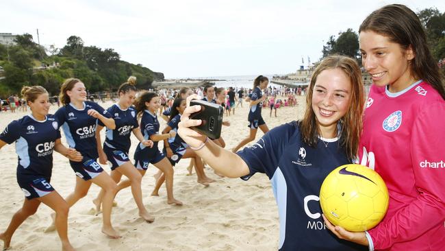 Dunbar Rover FC Girls U17 team members Elisha McMorrow and Emmanuelle Tobiano with their team at a Clovelly beach training session.Picture: John Appleyard