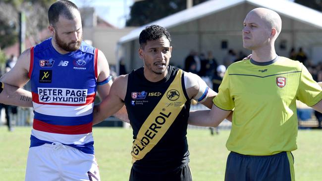 Marlon Motlop leads a stance against racism beofre the Tigers-Bulldogs clash at at Glenelg Oval on Staurday. Picture: Naomi Jellicoe