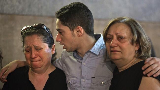 Mourners  grieve during prayers for the departed, remembering the victims of EgyptAir Flight-804, at Al-Boutrossiya Church, in the main Coptic Cathedral complex, in Cairo.