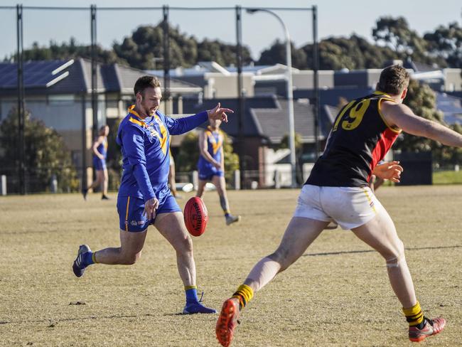 Curtis Barker takes a kick for Cranbourne.
