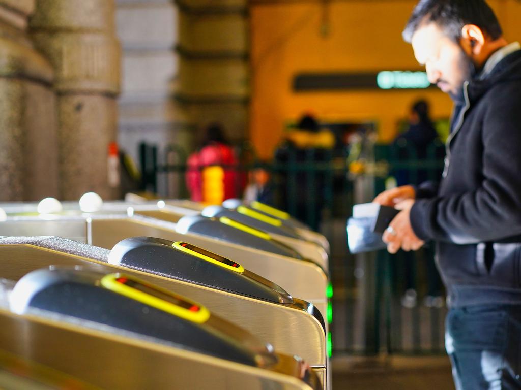 A long-awaited upgrade to the myki system will allow commuters to touch on with their bank cards and phones instead of their mykis. Picture: Luis Enrique Ascui