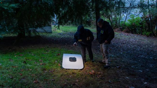 National Transportation Safety Board agents inspect the door plug from Alaska Airlines Flight 1282 after it was found in Portland, Oregon. Picture: AFP.