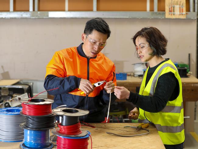 TasTAFE student, Yanbin Zhang and electrotechnology teacher, Caroline Alexander. Yanbin is retraining from his old career in China as a journalist and editor Photos by Matt Thompson