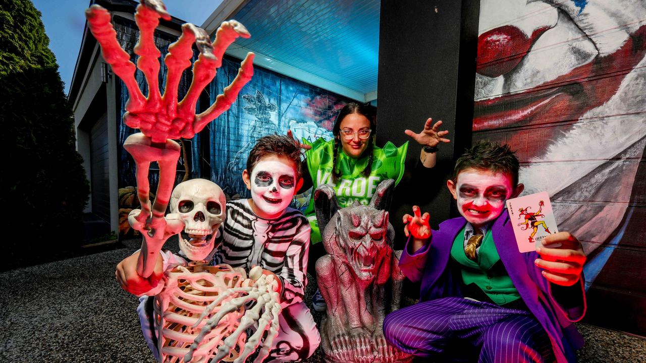 Natalie Mitchell with Roman, 10, Anna the skeleton and Harvey, 7, plan to raise money for charity at the Halloween party. Picture: Tim Carrafa