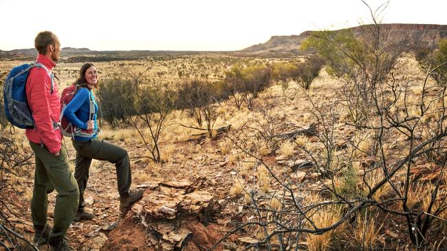 A couple hiking the Larapinta Trail.Tjoritja / West MacDonnell National Park stretches for 161 km west of Alice Springs. It’s one of the multiday walks the NT government plans to impose fees on.