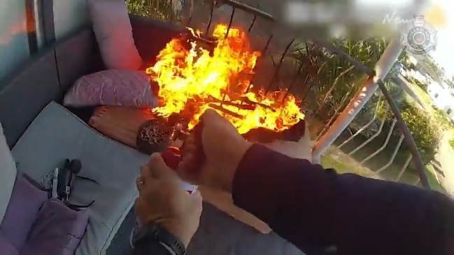 VIDEO: Rookie NQ cop scales wall to douse house fire