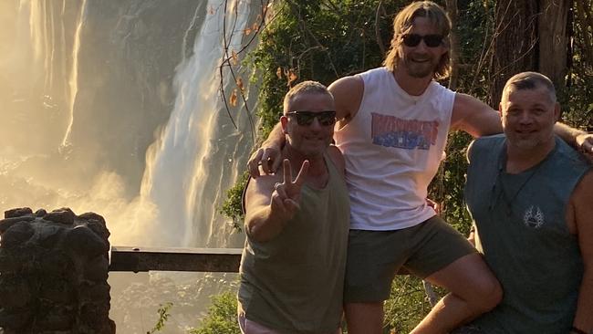 Jay Horne, Ryan Boxsell and Aaron Coshaw in Zambia. Mr Coshaw collapsed and passed away at Victoria Falls. Picture: Supplied.