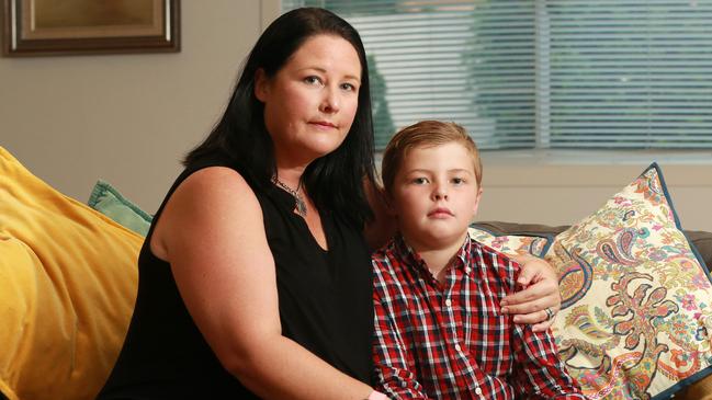 Katie Meredith and her son John, 9, at home in Scarborough. John flew as an unaccompanied minor to visit his grandmother in Sydney and the plane was diverted to Melbourne. His parents were not contacted by the airline until the next morning. (AAP/Image Sarah Marshall)