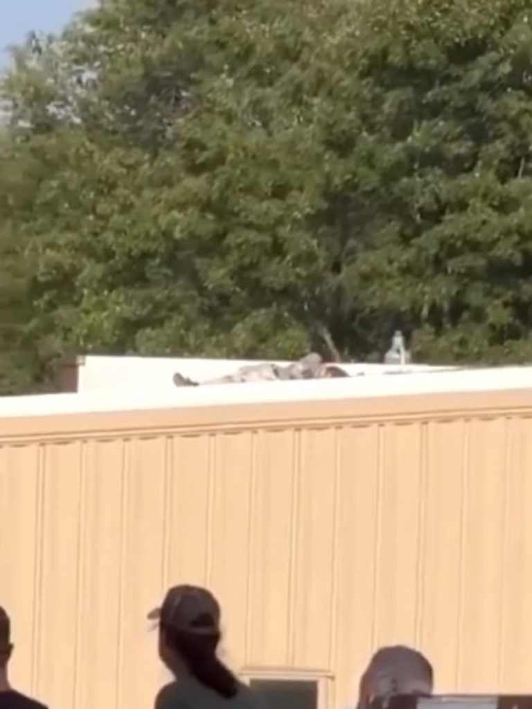 Footage circulating on social media allegedly shows the shooter on a rooftop after being shot.