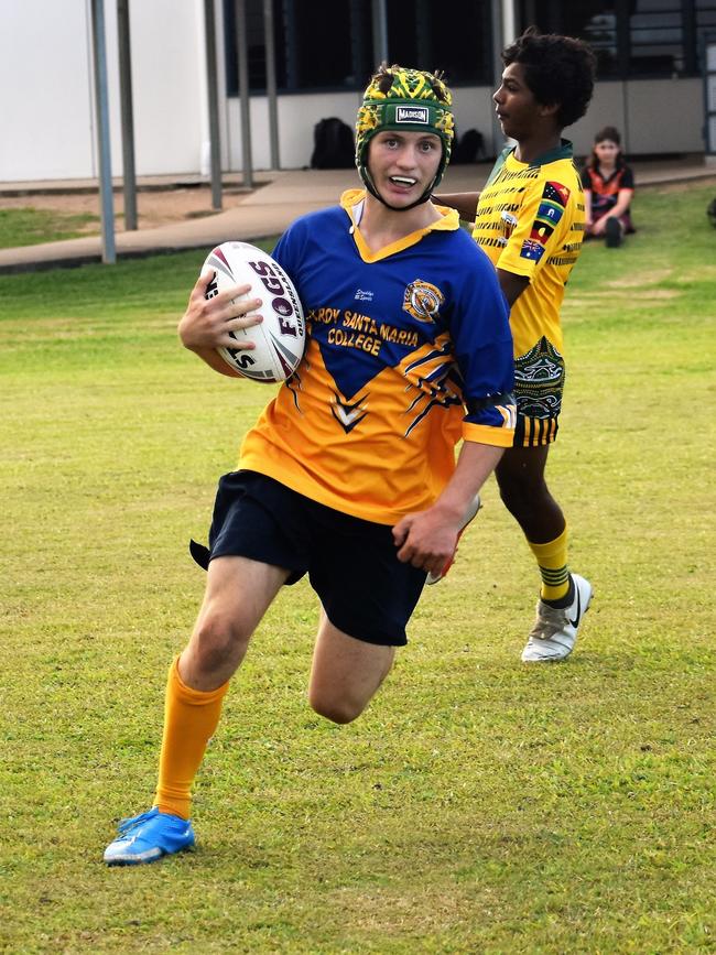Kelin Corradi, Gilroy, crosses over for a try. Photographs from the Will Murdoch Perpetual Shield. The annual U14 rugby league competition, in its second year, involved Gilroy Santa Maria College, Ingham State High School and St Teresa's Catholic College Abergowrie. Picture: Cameron Bates