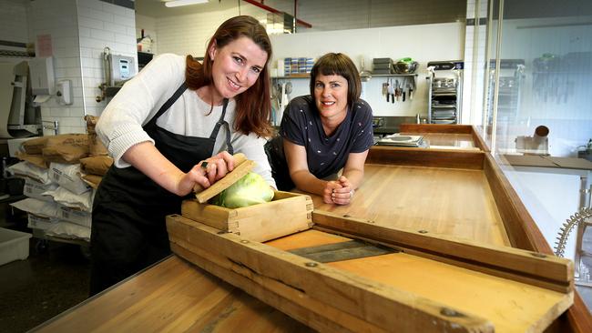 Hana Moran, left, making sauerkraut using an antique mandolin with MoMa food curator Jo Cook. Picture: SAM ROSEWARNE