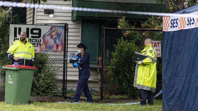 Detectives at the venue in Footscray where the woman’s body was found. Picture: Diego Fedele