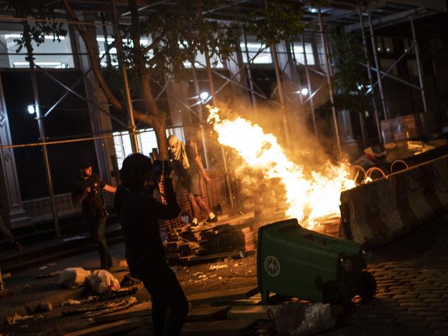 Protesters start fires along the Soho shopping district of Manhattan in protest over the death of George Floyd, a black man in police custody in Minneapolis. Picture: AP Photo