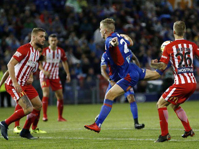 Riley McGree of the Jets scores a second-half goal from a 'scorpion' kick during the A-League Semi Final match between the Newcastle Jets and Melbourne City at McDonald Jones Stadium in Newcastle, Friday, April 27, 2018. (AAP Image/Darren Pateman) NO ARCHIVING, EDITORIAL USE ONLY
