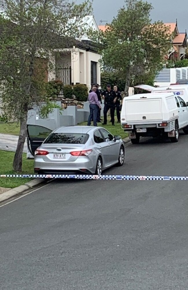 Authorities on scene at a Varsity Lakes residence after a woman's body was found. A man has also been rushed to hospital. Picture: Greg Stolz