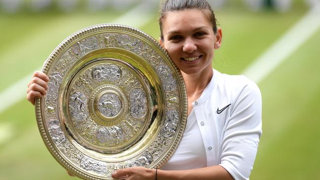 Simona Halep poses with the Venus Rosewater Dish after her win. Picture: Getty Images