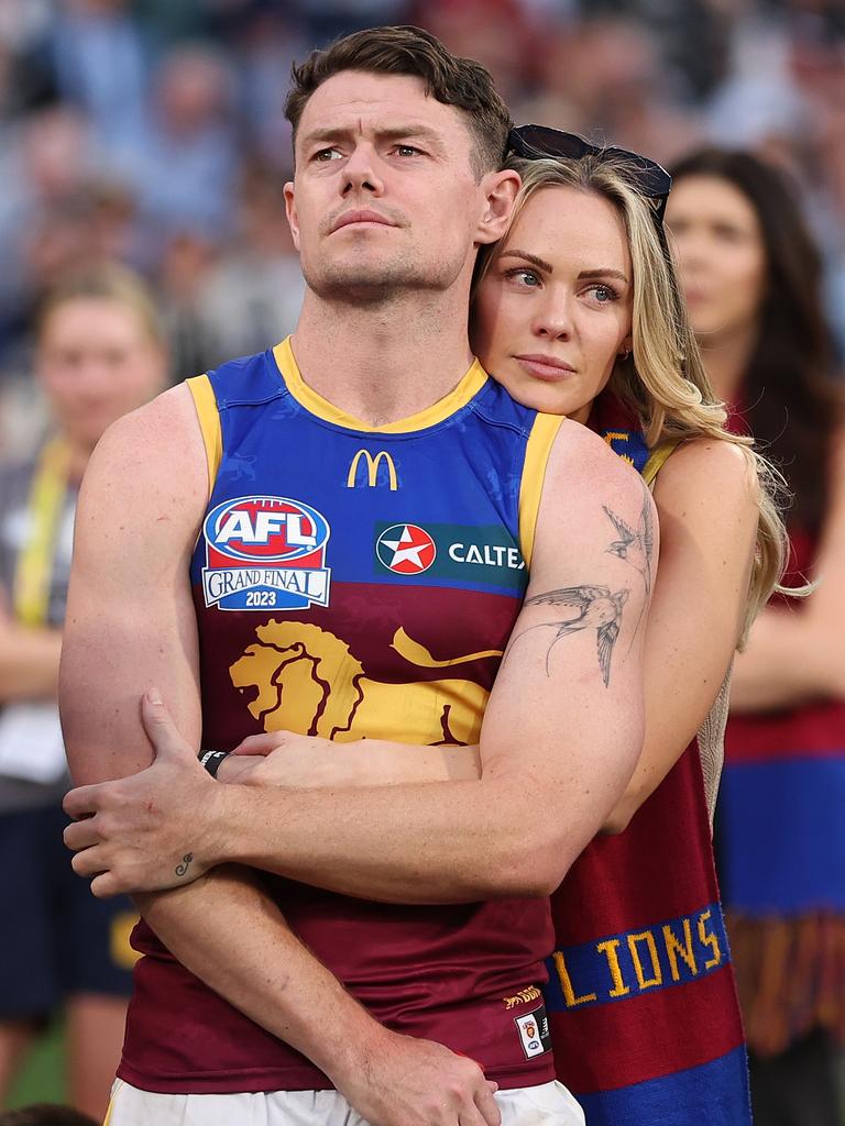 Lachie Neale comforted by wife Jules. Photo by Robert Cianflone/AFL Photos/via Getty Images.