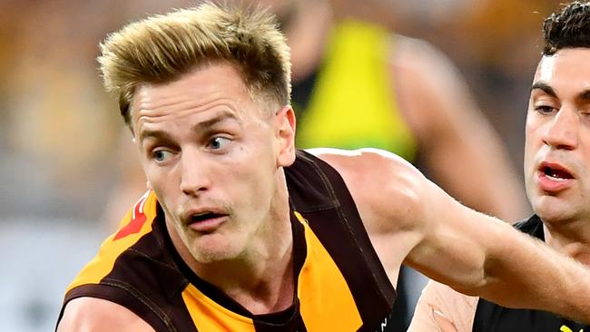 MELBOURNE, AUSTRALIA - AUGUST 18: Harry Morrison of the Hawks is tackled by Tim Taranto of the Tigers during the round 23 AFL match between Hawthorn Hawks and Richmond Tigers at Melbourne Cricket Ground, on August 18, 2024, in Melbourne, Australia. (Photo by Josh Chadwick/AFL Photos/via Getty Images)