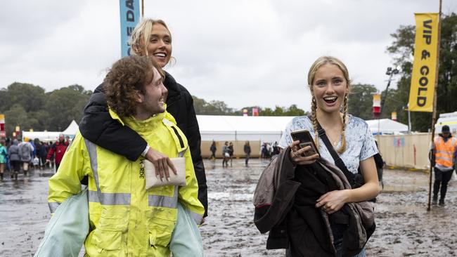 Festival-goers wade through deep mud at the washed-out Splendour in the Grass site near Byron Bay on Friday. Picture: Getty Images