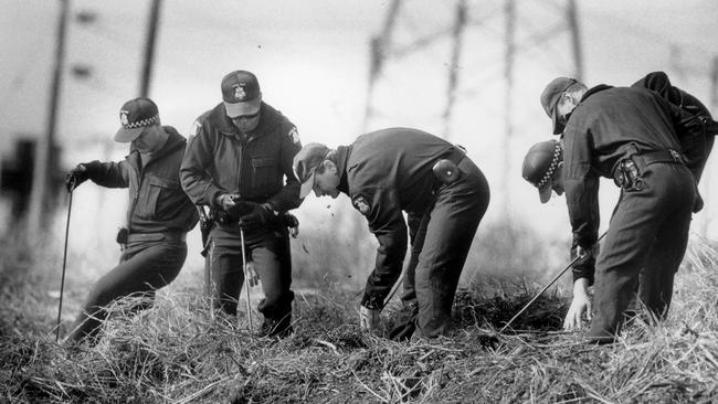 Police searching the area where Karmein’s body was found.