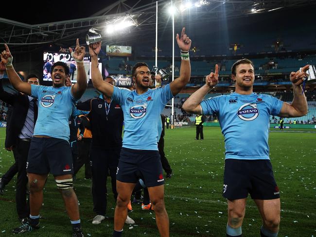 Waratahs players celebrate their finals win.