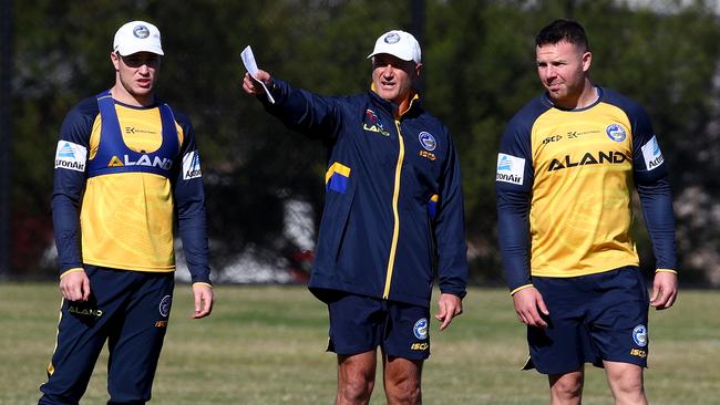 L-R Mitchell Moses, coach Brad Arthur and Nathan Brown talk tactics during training. Picture: Toby Zerna