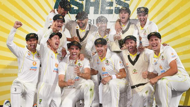 Australia's players celebrate with the Ashes trophy. (Photo by William WEST / AFP)