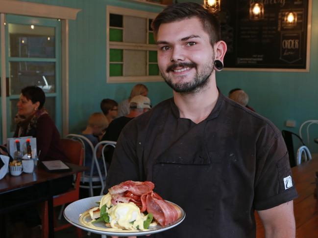 Chef Joshua Springfield with eggs benedict at Whisky Business Cafe