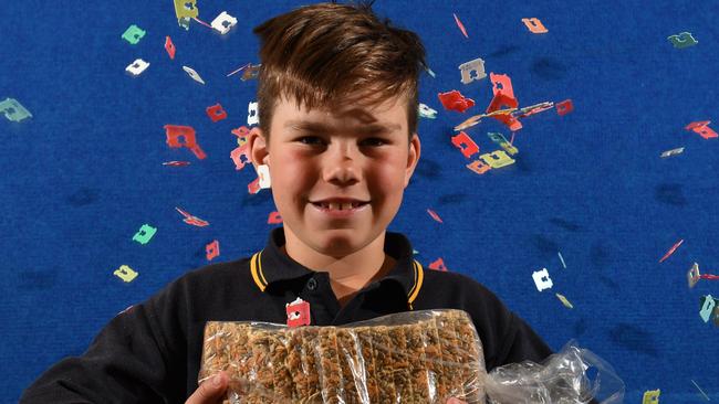 Port Noarlunga Primary school student Jake Hansen - 8yrs poses for a photograph at school in Port Noarlunga, Adelaide on Thursday the 19th of September 2019. Jake has been collecting bread tags for "Bread Tags for Wheelchairs" for the production of wheelchairs and is trying to get the whole community involved.  (AAP Image/Keryn Stevens)